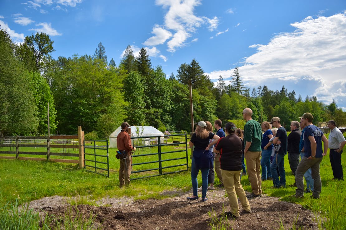 Russ Talmo helps install a permanent electric fence