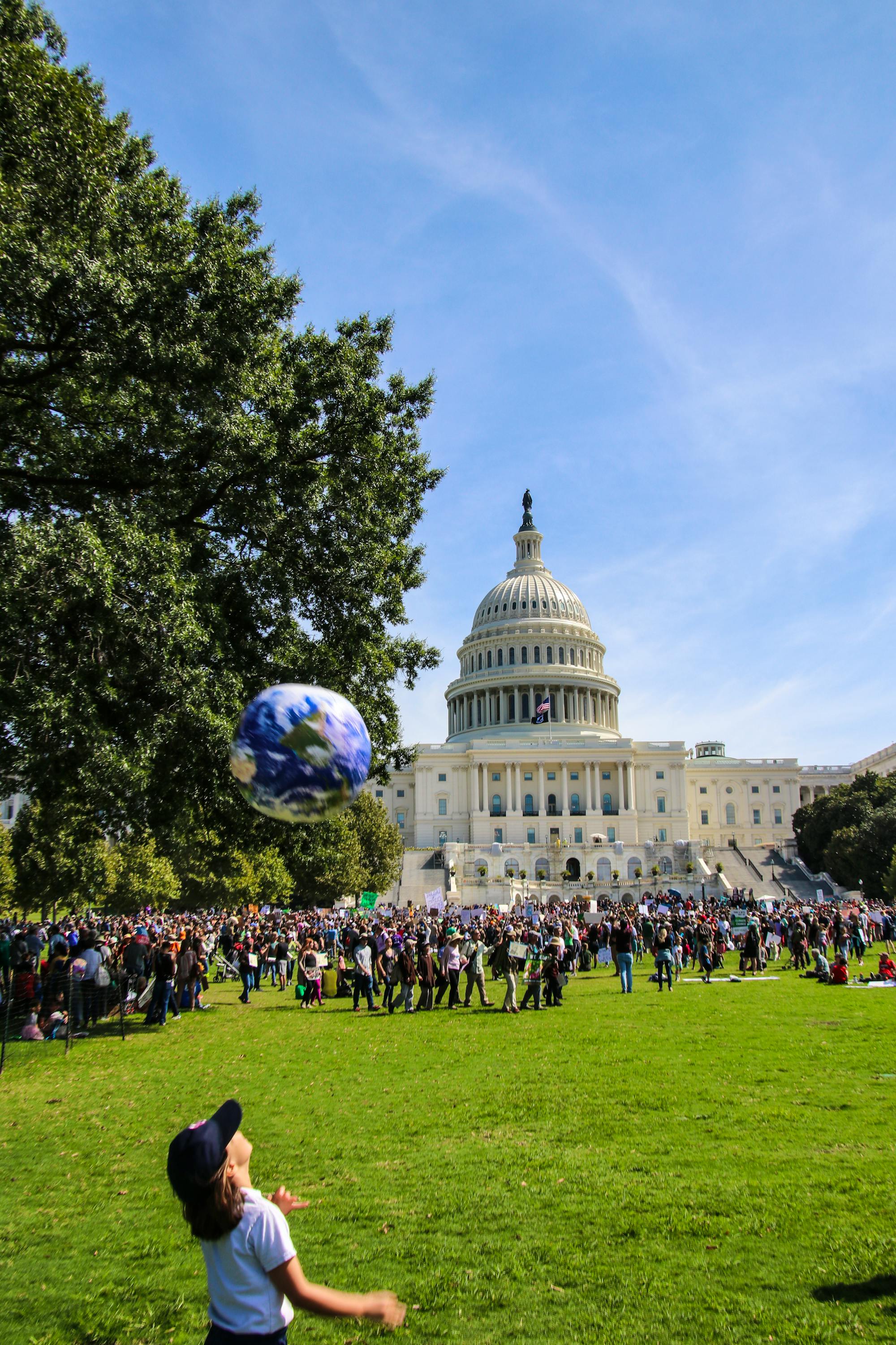 Climate Strike DC - Kid with globe Capitol Lawn