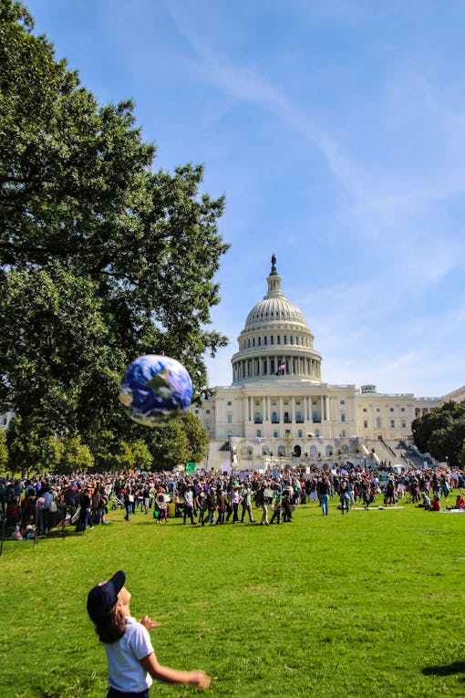 Climate Strike DC - Kid with globe Capitol Lawn