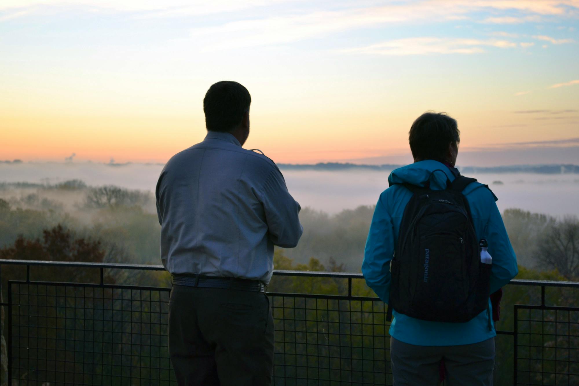 Refuge Manager Tim Bodeen takes in the sunrise with Secretary Sally Jewell at Minnesota Valley National Wildlife Refuge 