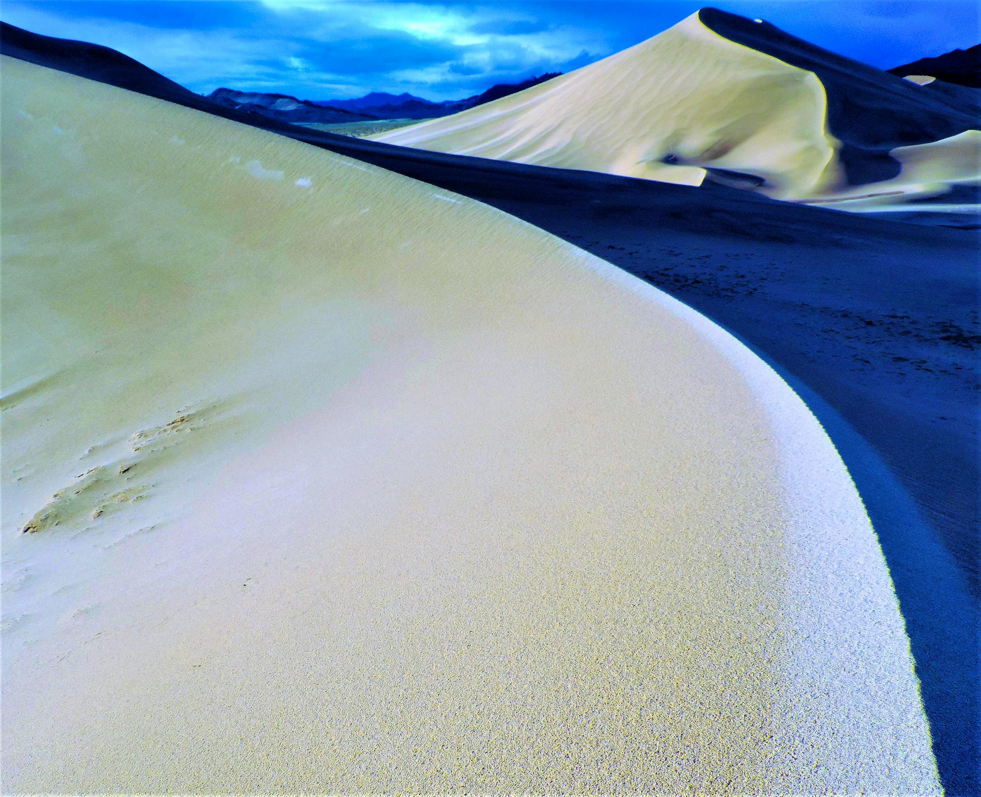 Ibex Dunes, adjacent to the Saddle Peak Hills Wilderness, with a glimpse of Telescope Peak, in the Panamint Range (background) of Death Valley National Park