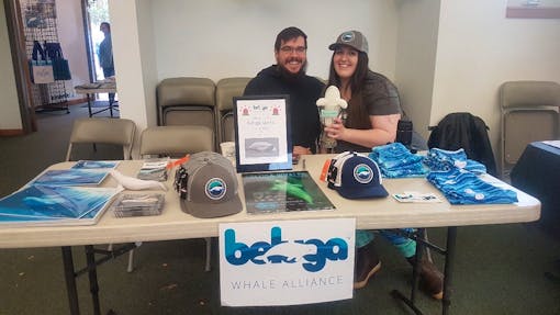 Beluga whale alliance volunteers manning the booth 