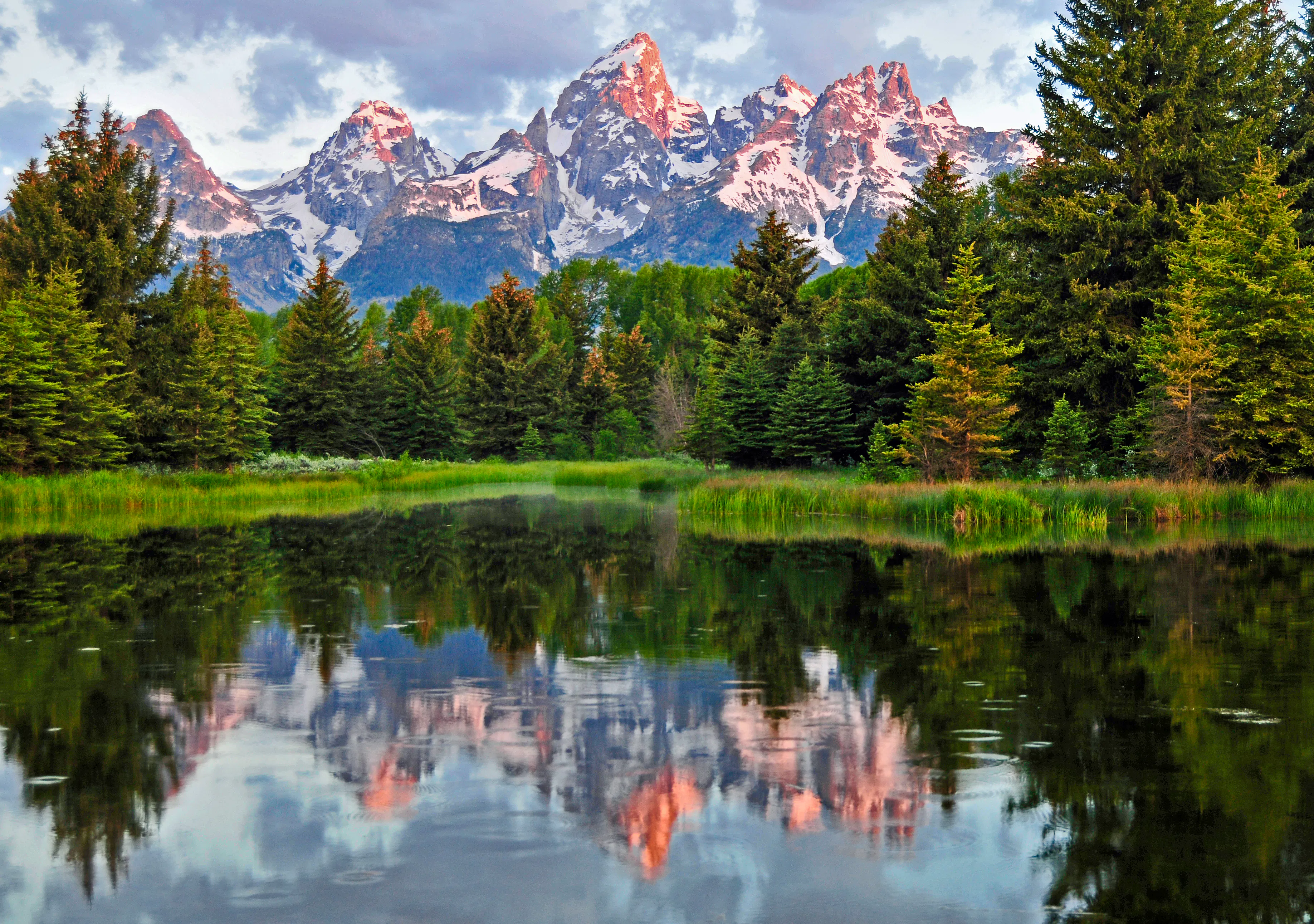 Schwabercher's Landing Grand Teton National Park with tetons and trees reflecting in water