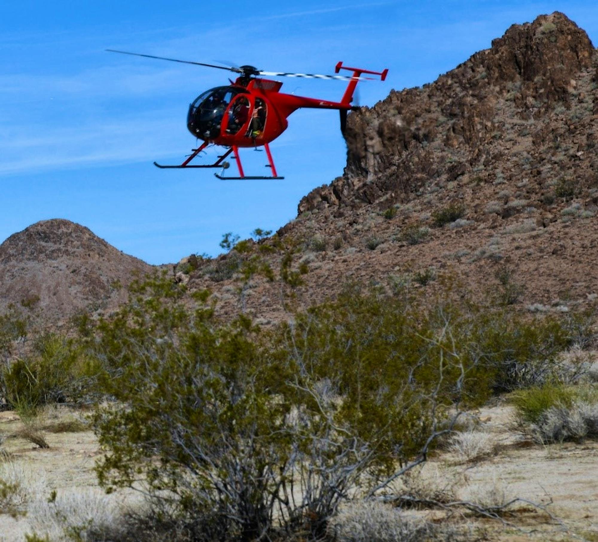 California Department of Fish and Wildlife’s contracted Helicopter Bighorn Capture Crew in a 2018 flight at the Marble Mountains of the California Desert.