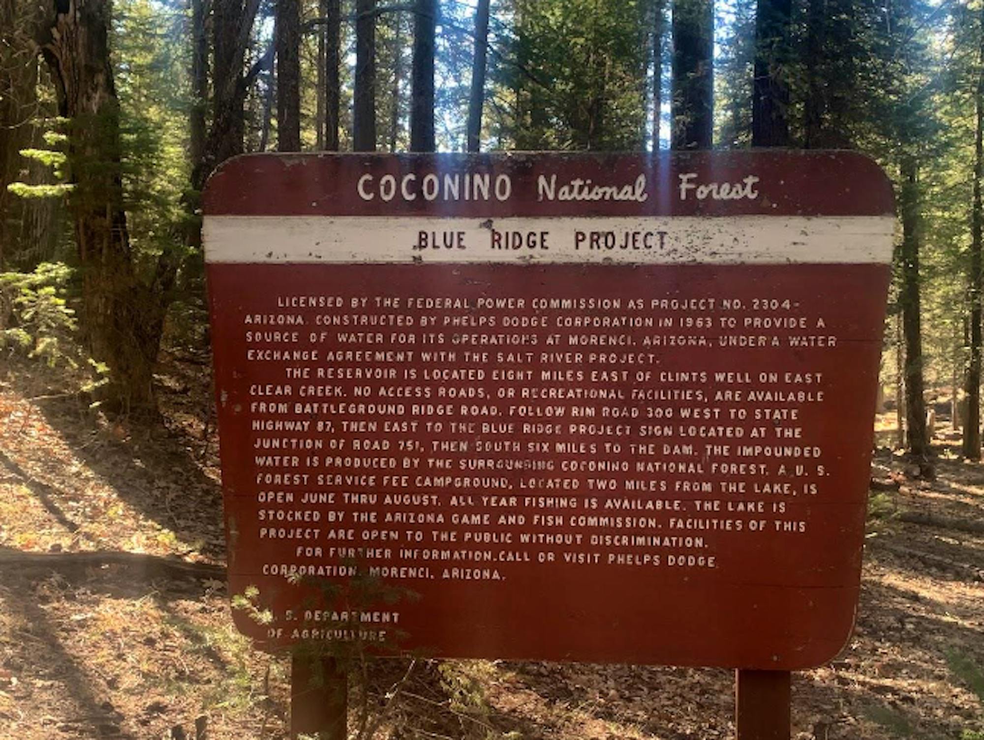 Sign explaining blue ridge project in forest