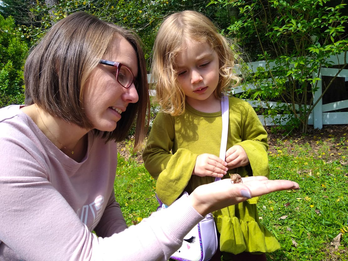 Lindsay and daughter looking at cicadas 