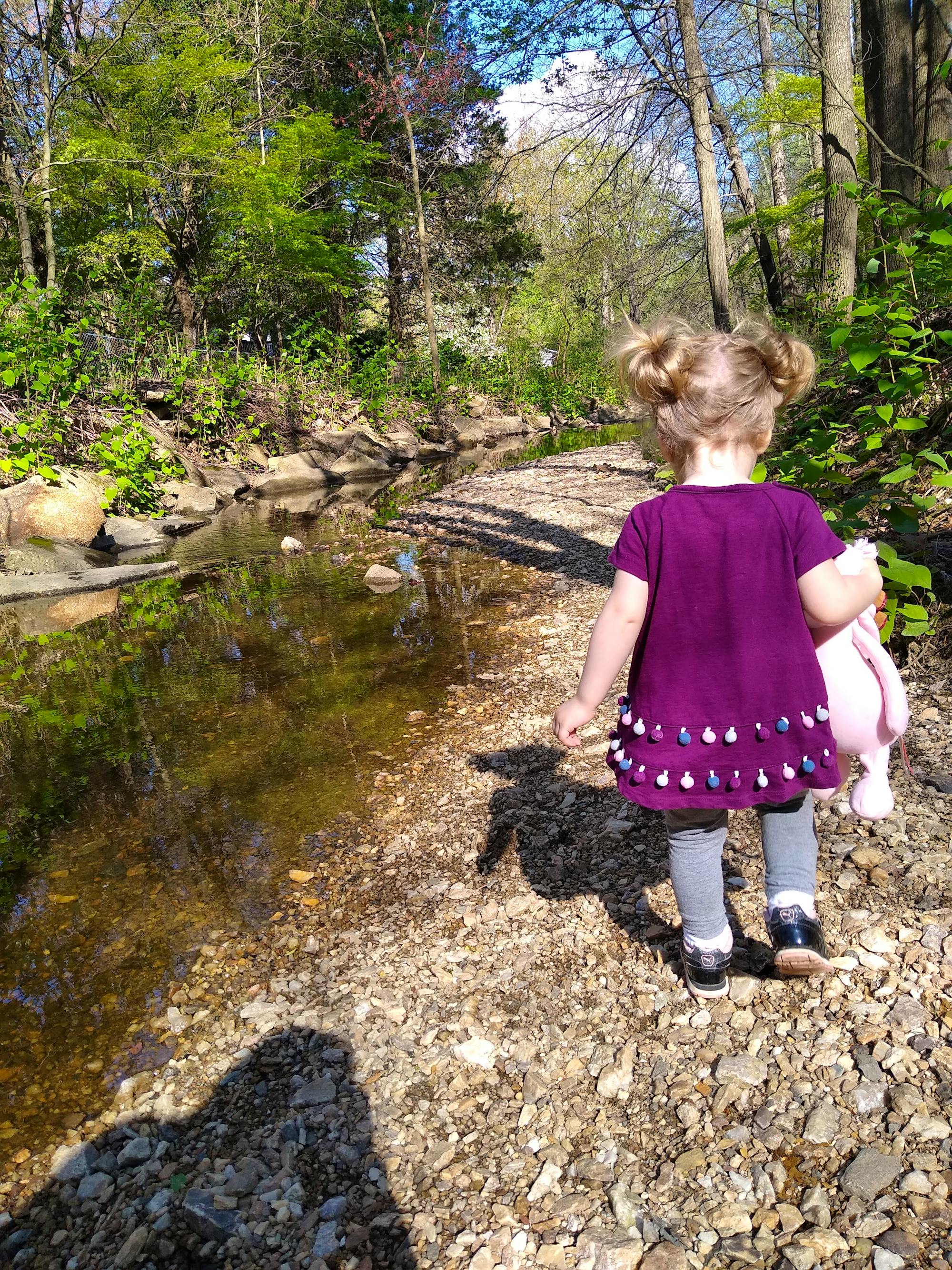 Girl walking through woods