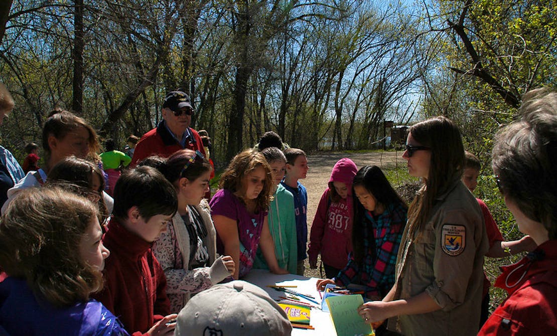 Minnesota Valley National Wildlife Refuge Intern Katie Laughlin talks with the students about creating a nature journal for the day