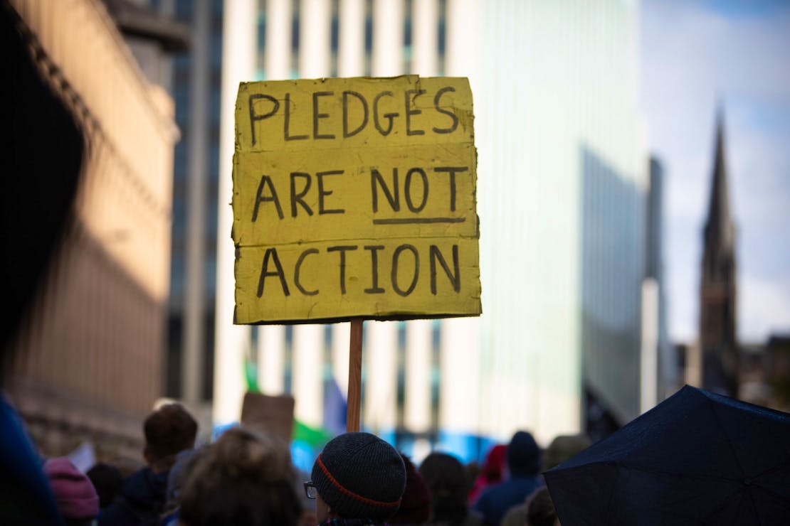 Climate activists bring the message "Insure Our Future" to COP26