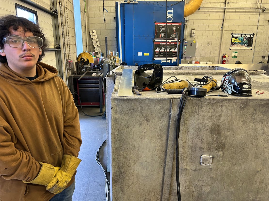 Kodiak High School welding students work on a bear-resistant dumpster courtesy of Isabel Grant, Defender's consultant.