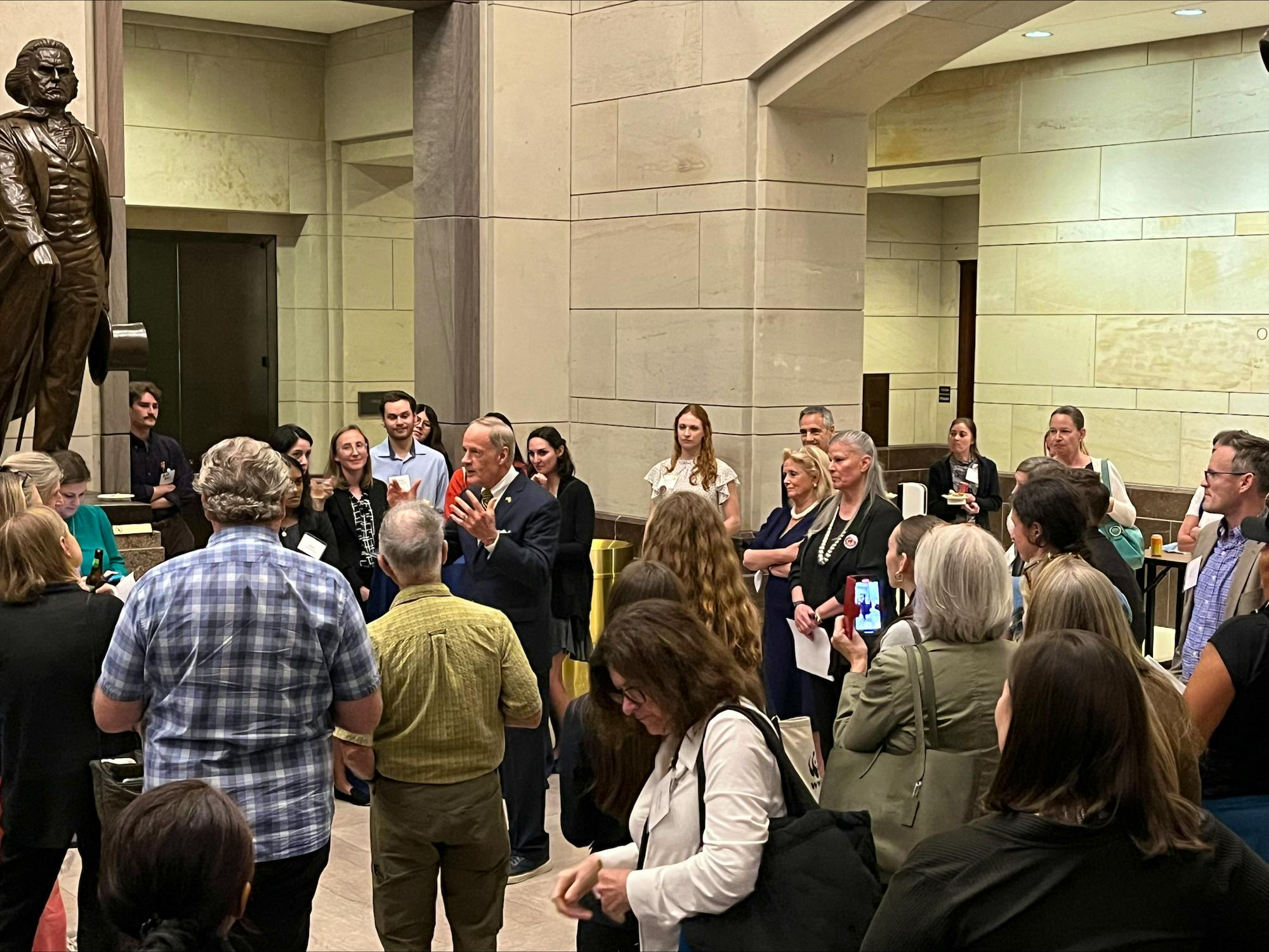 2023.09.12 - DC - ESA Symposium - Tom Carper speaking to crowd in atrium - Natalie Palmer-Defenders of Wildlife