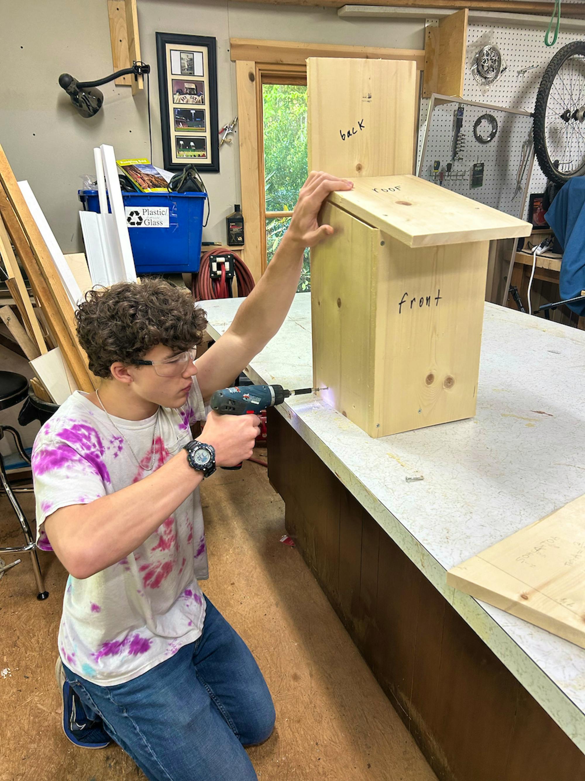 2023.09.14 - SE - Northern Saw-Whet Owl Box Project - Colin building box with screwdriver - Erin Fowler, Scraps of Lace Photography