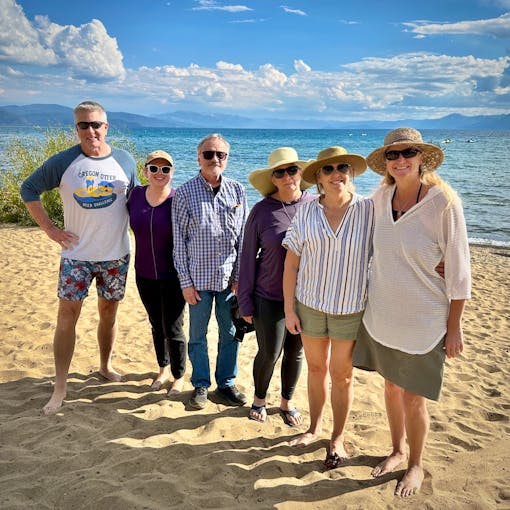 Four members of Defenders' California team plus two consultants (Andy Johnson, Ashley Overhouse, Jeff Aardahl, Kate Kelly, Kim Delfino, Pam Flick) stand on a beach for a group photo during their program retreat in September 2023.