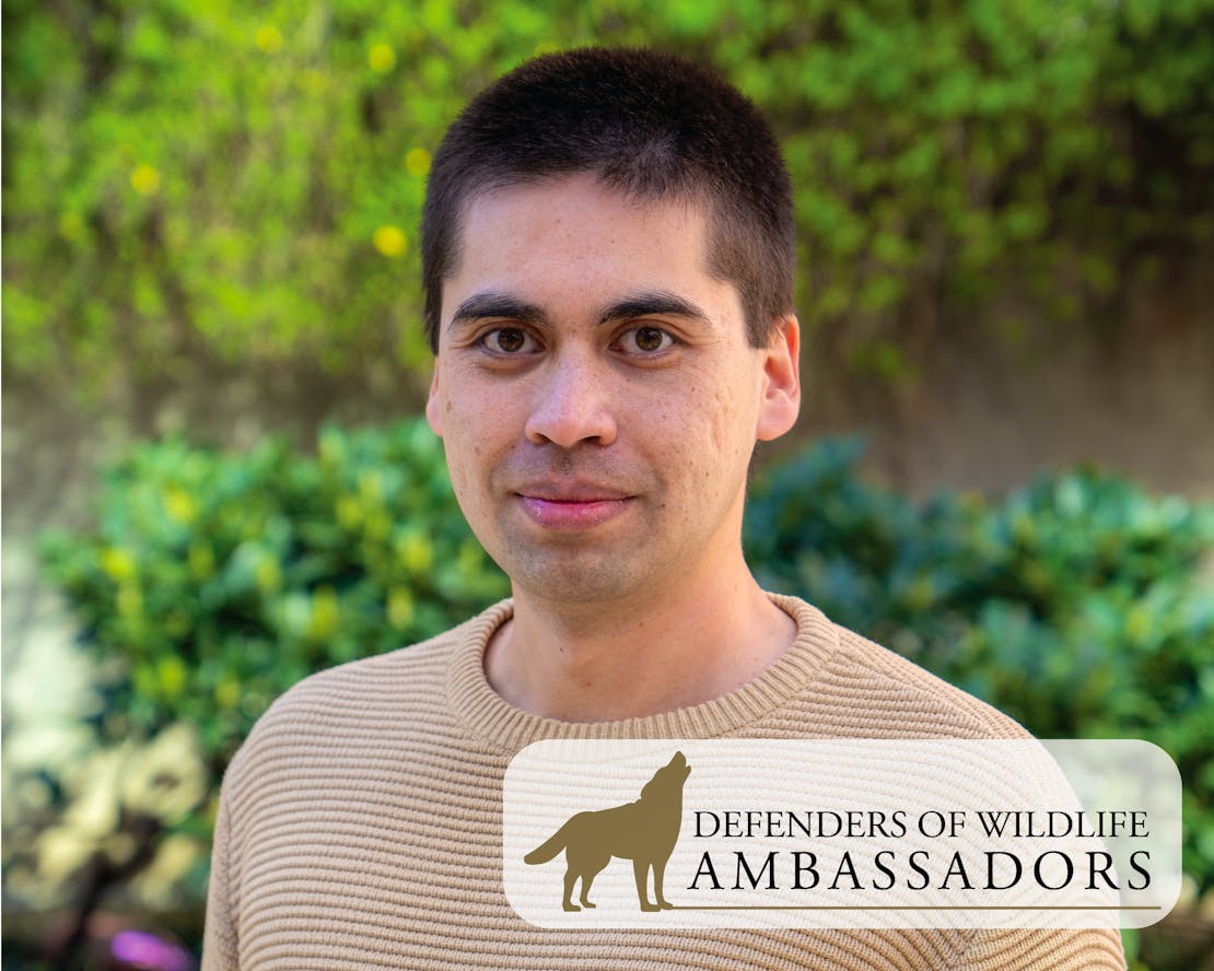 Travis with Wildlife Ambassadors Logo