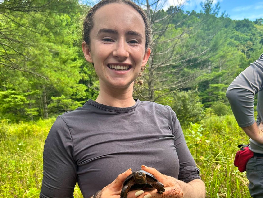 Helen Morris posing with a bog turtle