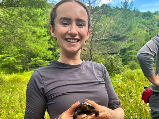 Helen Morris posing with a bog turtle