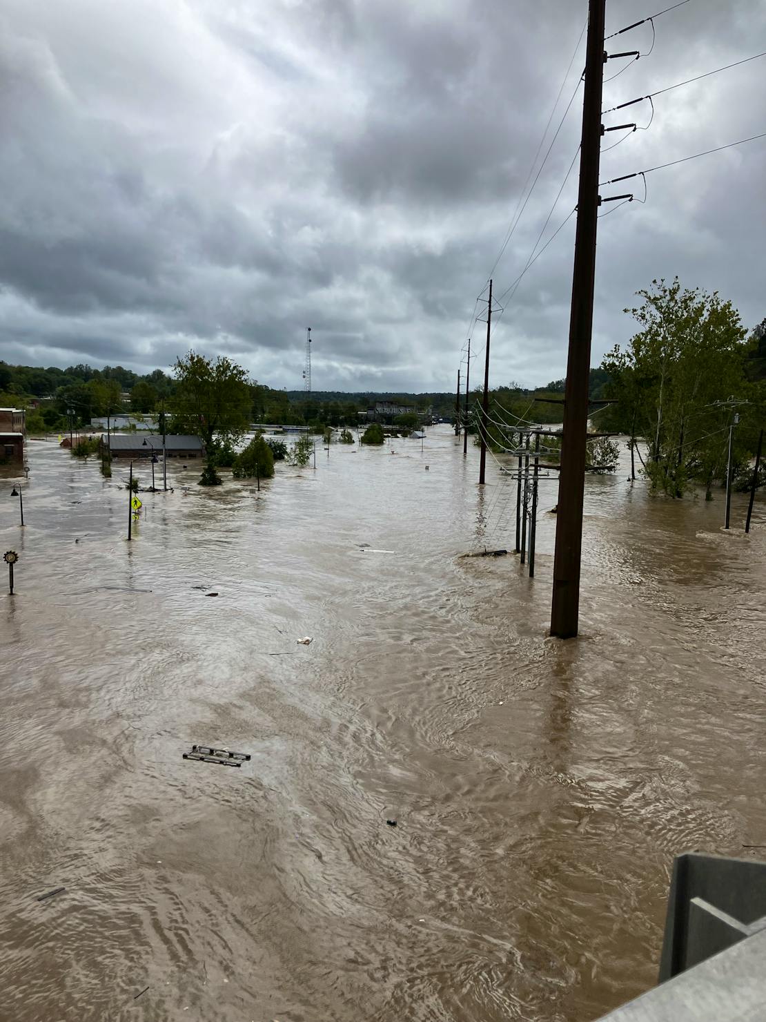 Streets flooded by the French Broad River in Asheville NC after Hurricane Helene hit