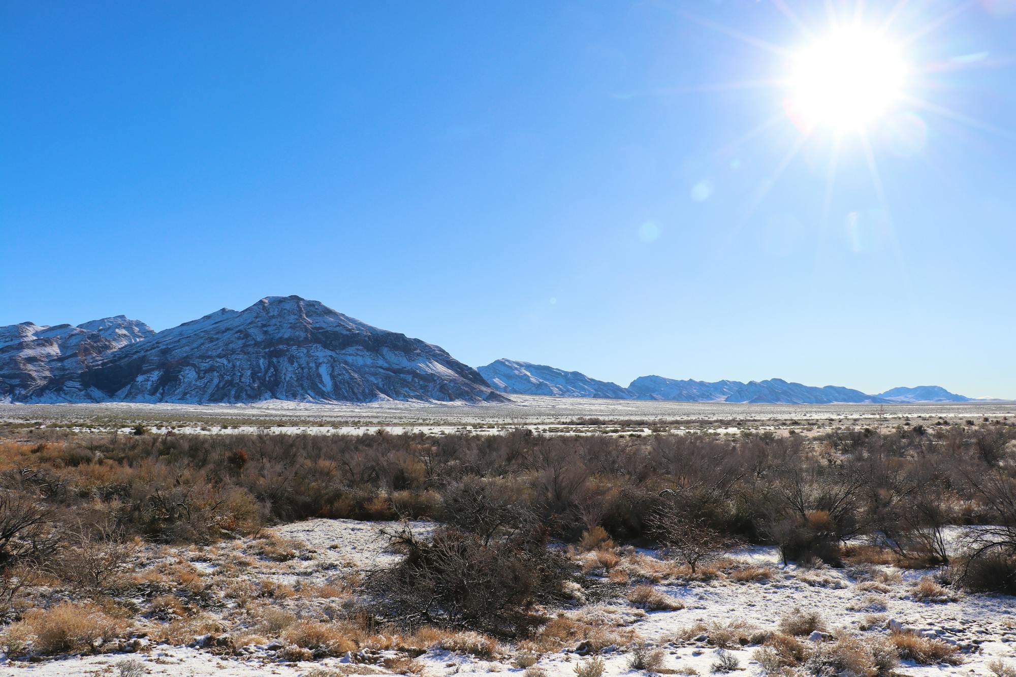 2024.01.11 - Ash Meadows National Wildlife Refuge - sun shining on snowy landscape - Nathan Marcy-Defenders of Wildlife.JPG