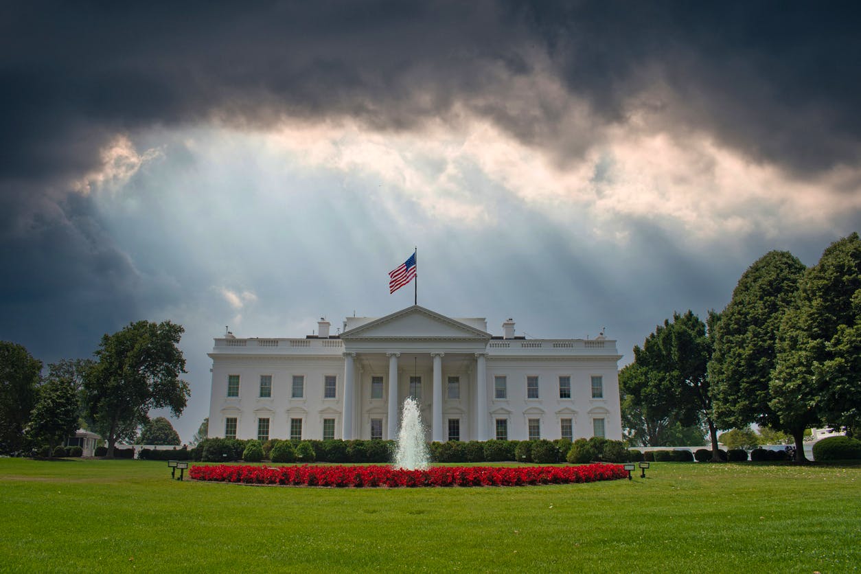 The White House with a dark cloudy sky