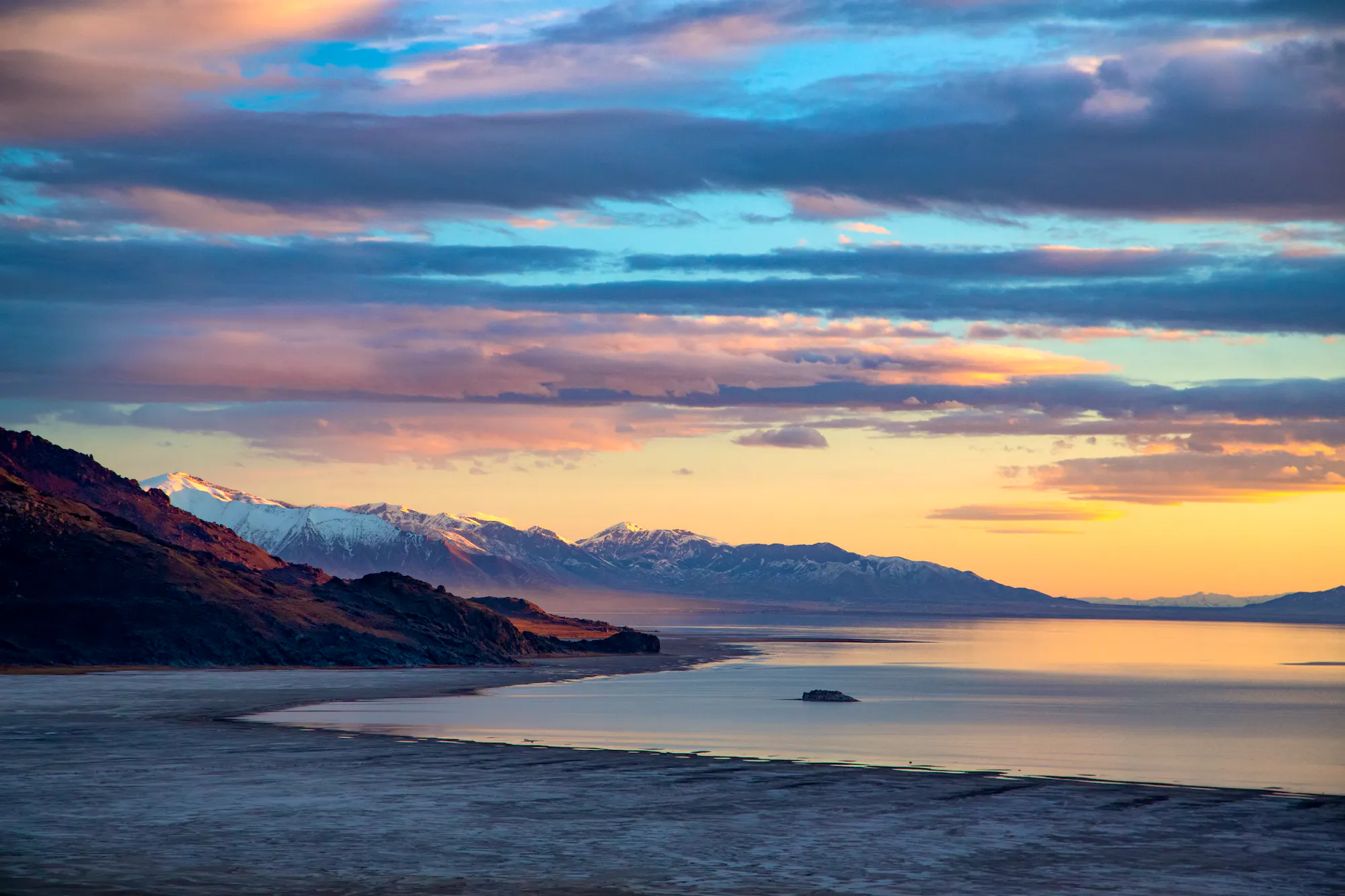 The arid desert of Antelope Island sits in the waters of Great Salt Lake, creating a surreal juxtaposition of the desert and water.
