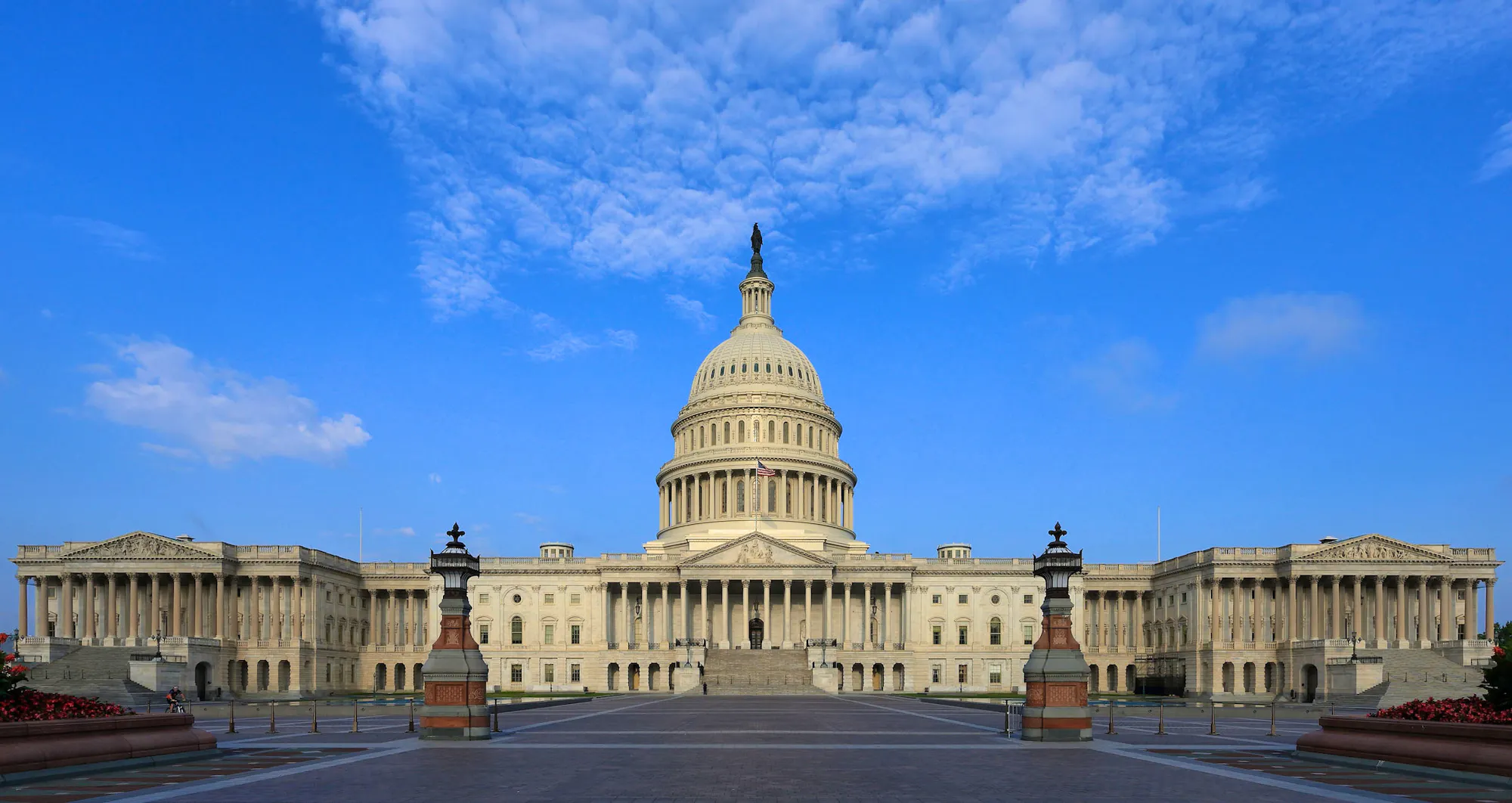 capitol building at sunset with clouds in the sky